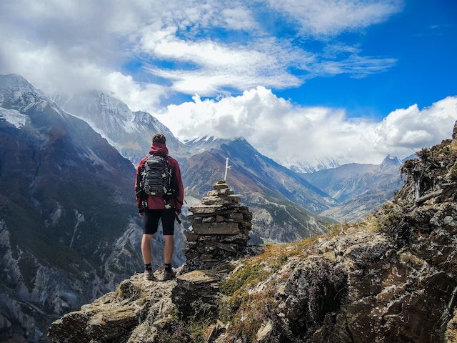 A hiker climbed at the top of the mountain